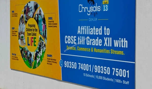 Detailed informational display at Chrysalis High Gunjur showcasing the academic excellence and CBSE curriculum available to Prestige Evergreen residents