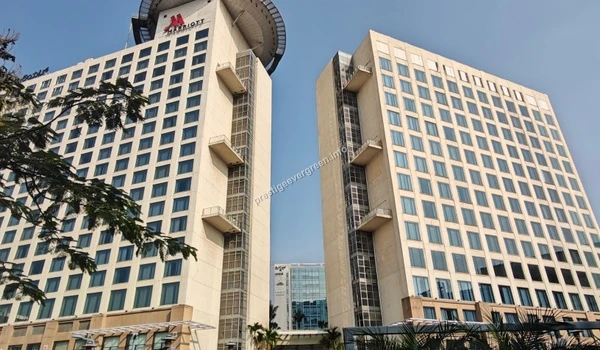 Wide angle view showing the dual tower structure of the Marriott hotel near Prestige Evergreen