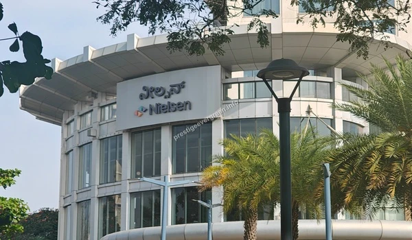 Exterior view of the Nielsen corporate office building with modern architecture near Prestige Evergreen