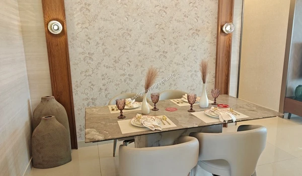 Spacious dining area interior in the Prestige Evergreen 1486 sqft model apartment showcasing premium marble finishes and decor