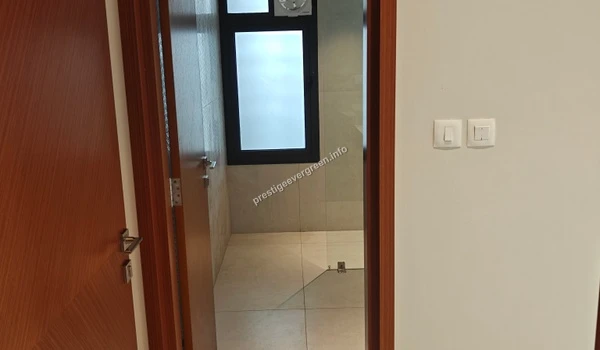 Detailed view of the master bathroom at Prestige Evergreen showing high-quality sanitary ware, glass partition, and premium tile finishes in a 3 BHK model apartment