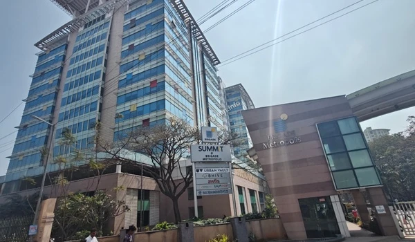 A comprehensive street-level view of the Brigade Metropolis Summit complex showcasing the vibrant business environment near Prestige Evergreen