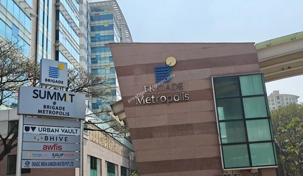 Detailed view of the corporate signage at Brigade Metropolis Summit featuring various IT firms near the Prestige Evergreen project