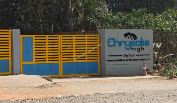 Entrance gate and specific signage for Chrysalis High Varthur branch near Prestige Evergreen