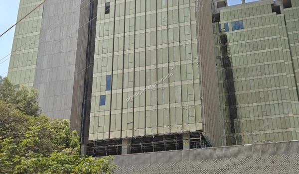 Detailed architectural view of the corporate tower at Prestige Tech Habitat highlighting the urban commercial growth around the Sarjapur area