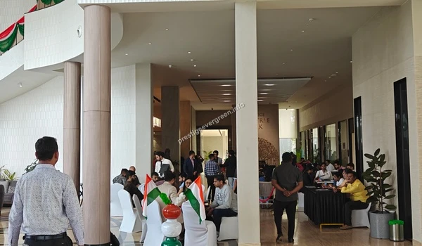 Dedicated customer consultation zone at the Prestige Evergreen site office with professional staff assisting homebuyers with project details