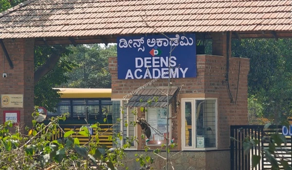 The distinctive brick masonry entrance of Deens Academy Gunjur featuring traditional architecture near the Prestige Evergreen development