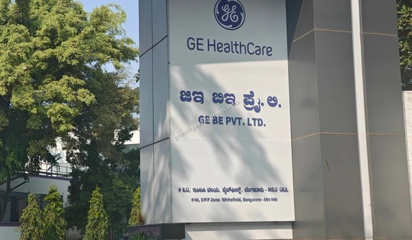 Close-up view of the GE HealthCare signage pillar near Prestige Evergreen