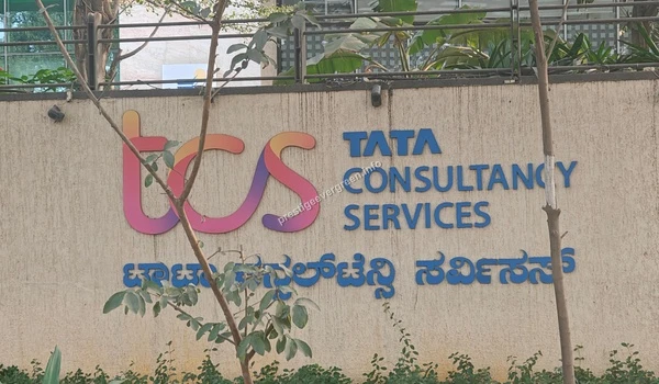 The official Tata Consultancy Services (TCS) corporate branding on-site, highlighting the premium employment ecosystem surrounding Prestige Evergreen