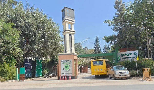 The main entrance gateway and architectural clock tower of Greenwood High International School situated near Prestige Evergreen