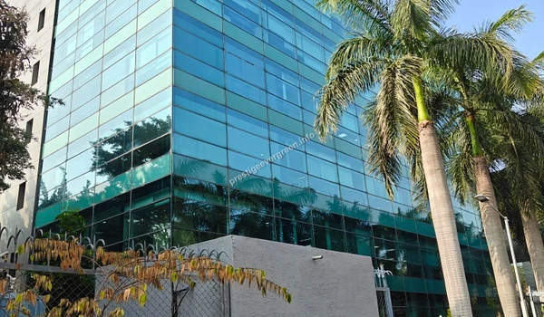 Modern glass facade of a corporate building in the tech park near Prestige Evergreen