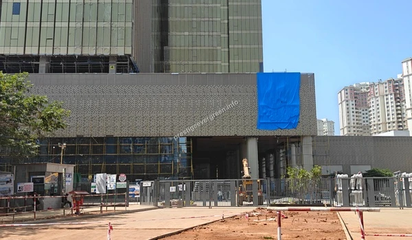 Modern glass facade of an IT building under development at Prestige Tech Habitat, showcasing the area's growth near Prestige Evergreen