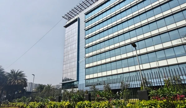Modern multi-story glass facade IT building located near Prestige Evergreen showcasing contemporary office space architecture