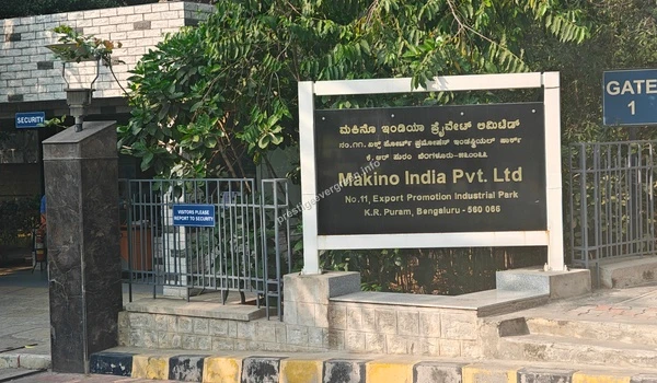 Close-up view of the Makino India corporate logo signage highlighting the proximity to Prestige Evergreen