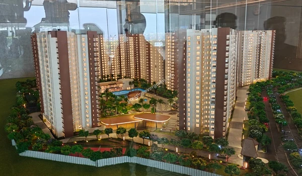 Top-down perspective of the Prestige Evergreen architectural model highlighting the central amenities, swimming pool area, and internal driveway