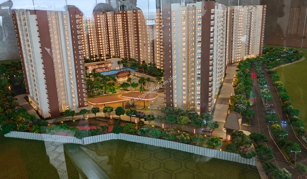 Bird's eye perspective of the Prestige Evergreen miniature model showcasing the master plan, internal roads, and expansive open spaces