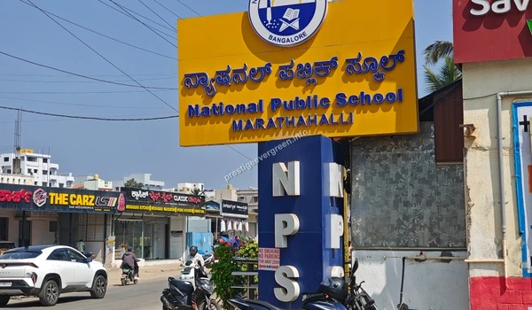 Signage board of National Public School Marathahalli located in close proximity to Prestige Evergreen