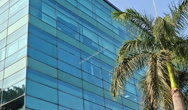 Close-up architectural view of a modern office building glass exterior near Prestige Evergreen