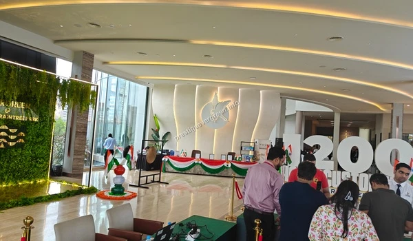 The vibrant interior of the Prestige Evergreen site office lounge area with glass facades and modern architectural design elements