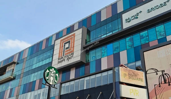 A close-up view of the Park Square Mall facade featuring the Starbucks logo, providing a vibrant commercial hub for the residents of Prestige Evergreen.