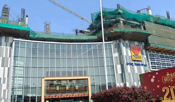 A closer look at the impressive glass facade of Phoenix Marketcity, offering a world-class shopping experience to the community around Prestige Evergreen.