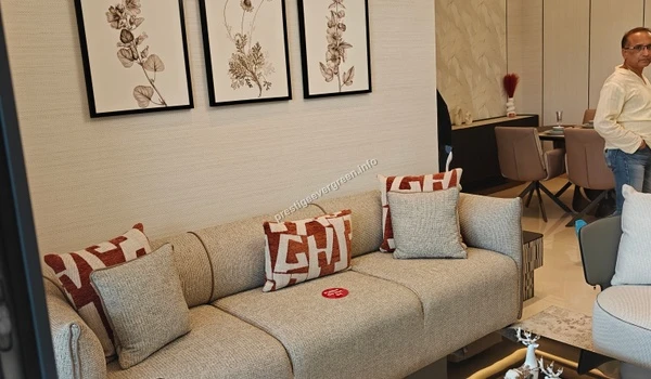 Perspective view of the living hall in a Prestige Evergreen apartment showcasing the high-quality interior finishes and stylish botanical wall art