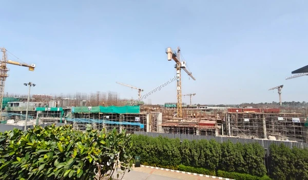 View of the internal access road at Prestige Evergreen facilitating construction machinery and logistics within the Raintree Park site