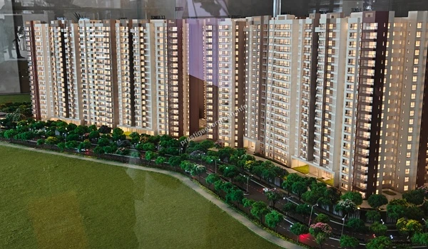 A scenic view of the internal boulevard and tree-lined walkways within the Prestige Evergreen residential community model