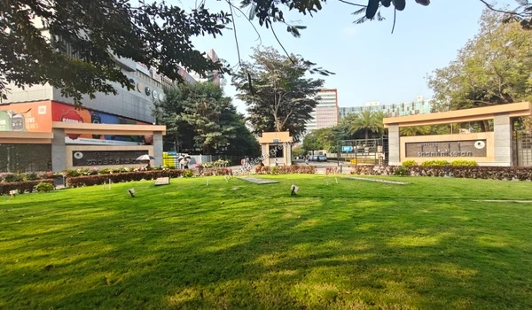 Wide angle view of the Prestige Shantiniketan entrance and landscaped lawns near Prestige Evergreen