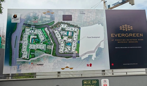 Detailed master plan signage displayed at the Prestige Evergreen site office showing building layouts and future development areas