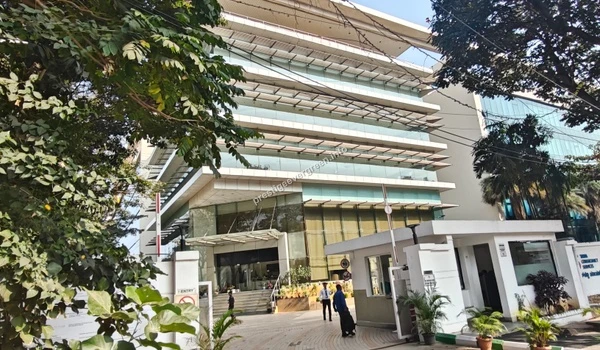 View of the modern TCS office building entrance showcasing the employment hubs near Prestige Evergreen