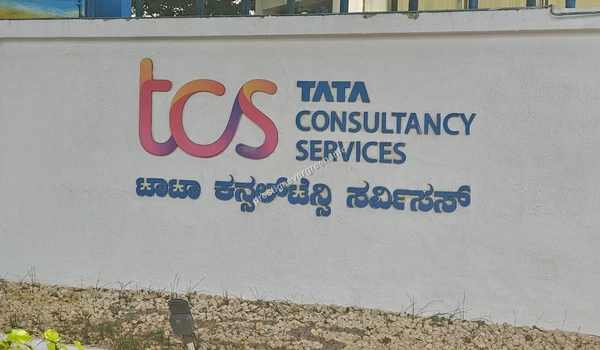 View of the Tata Consultancy Services (TCS) signage wall located near Prestige Evergreen