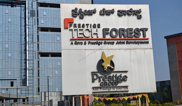 Detailed view of the Prestige Tech Forest signage board indicating a joint development by Gera and Prestige Group near Sarjapur