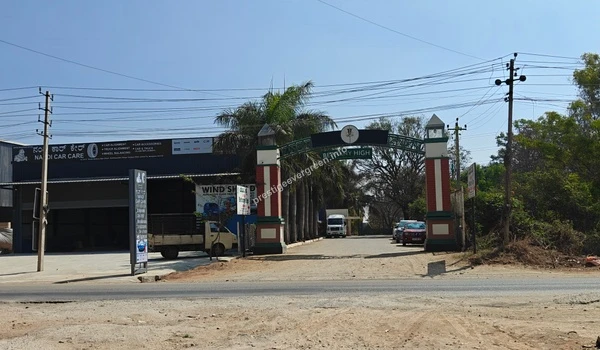 Exterior view of the entrance gate to a business park area near Prestige Evergreen, showing local connectivity and infrastructure