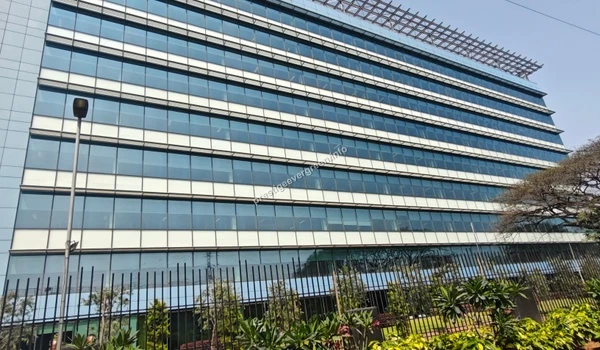 Exterior architectural view of a modern glass-facade IT tech park building located near Prestige Evergreen in Bangalore
