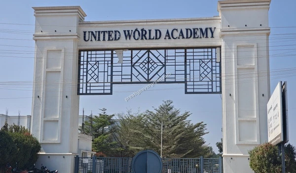 A close-up view of the architectural design of the United World Academy entrance gate near Prestige Evergreen