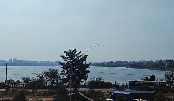 Capturing the impressive cityscape of Whitefield and Varthur across the lake waters as seen from the vantage point of the Prestige Evergreen development