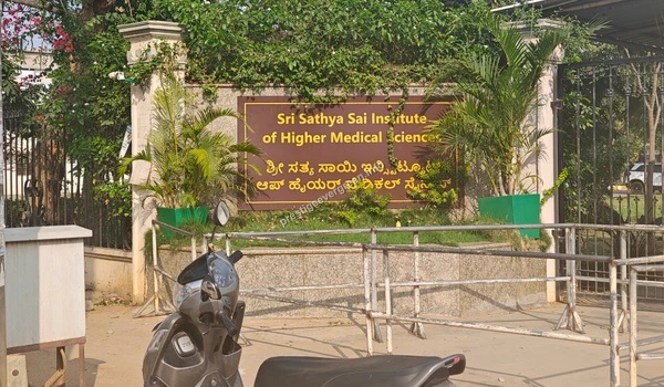 Entrance board of Sri Sathya Sai Institute of Higher Medical Sciences located approximately 6 km from Prestige Evergreen